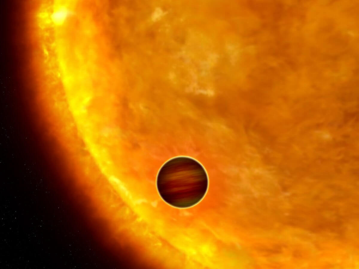 木星サイズの系外惑星が主星の手前を横切る様子を描いた想像図（Credit: NASA, ESA and G. Bacon）