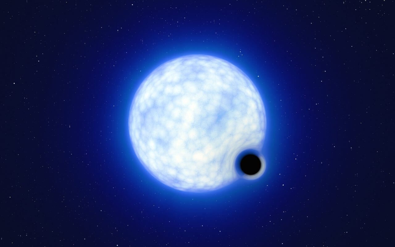 【▲ 連星「VFTS 243」の想像図（※ブラックホールによる時空の歪みは強調して描かれています）（Credit: ESO/L. Calçada）】