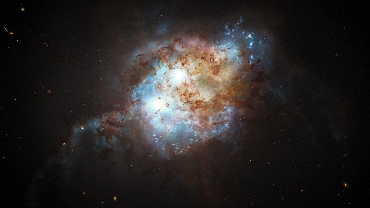 【▲ 二重クエーサー「J0749+2255」が存在する合体銀河の想像図（Credit: NASA, ESA, Joseph Olmsted (STScI)）】