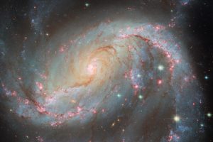 どこかに写っている超新星　ハッブル宇宙望遠鏡が撮影した棒渦巻銀河「NGC 1672」