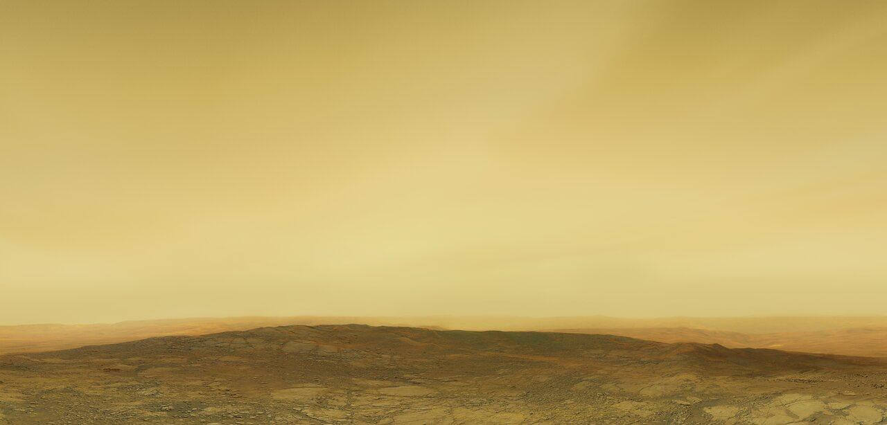 約460℃の世界 金星の地表と厚い大気を描いた想像図