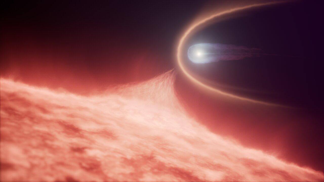 赤色巨星の中を突き進む白色矮星 前方に広がる白い弧の正体